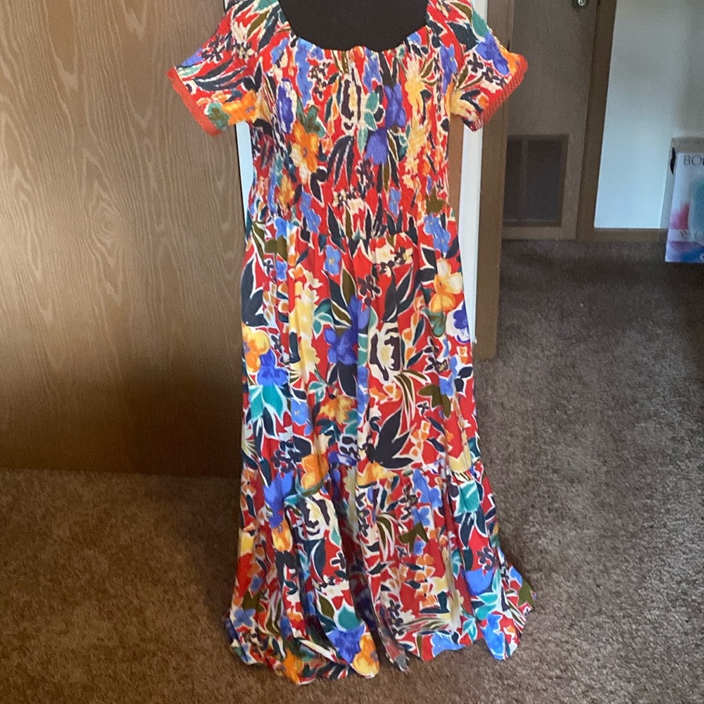 Full of flowers smocked bodice and tiers with an off the shoulder neckline